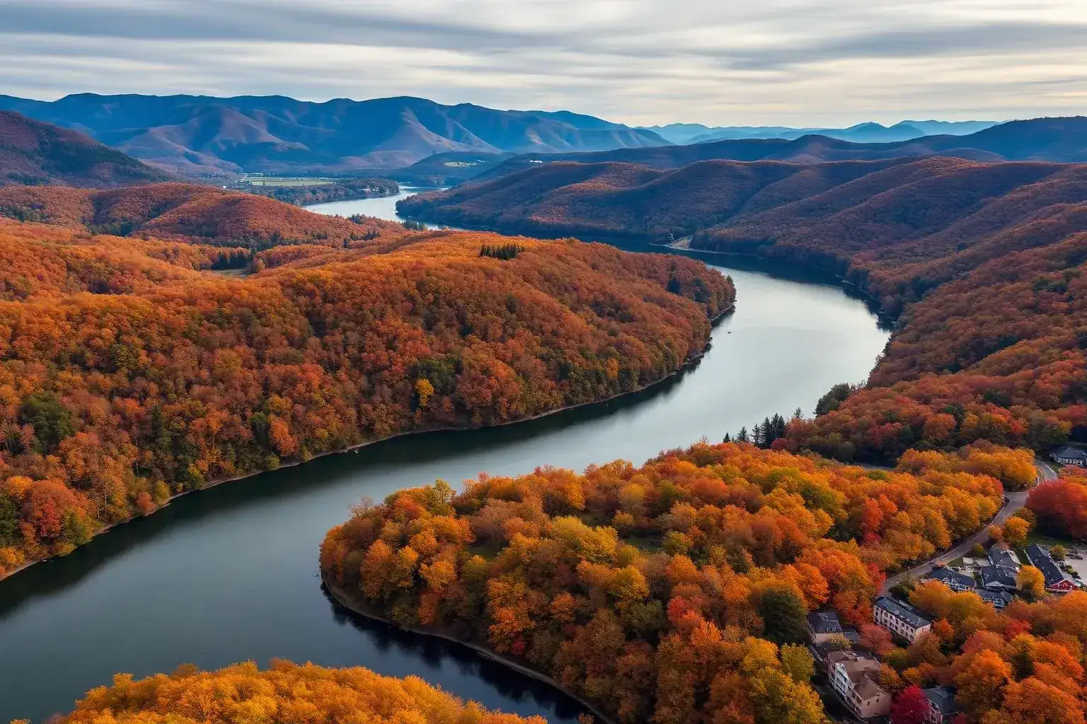 Aerial drone view of the Hudson Valley and Catskill Mountains in peak autumn foliage — the region Bodhi Digital Marketing serves with AI-first local SEO
